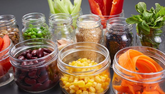 Glass containers filled with various vegetables