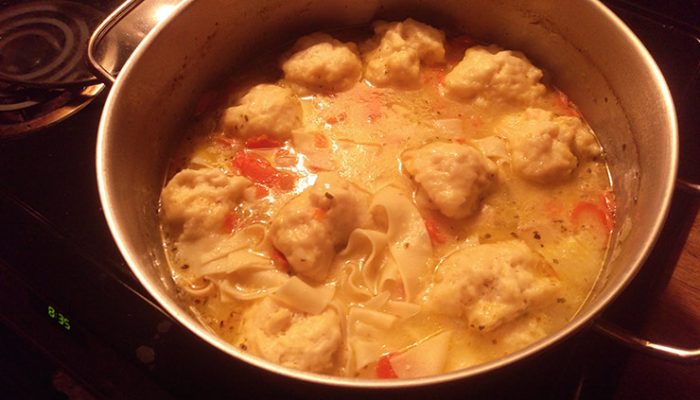 Pot Of Chicken Noodle Soup With Dumplings