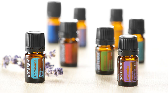 Essential oil bottles with a sprig of lavender