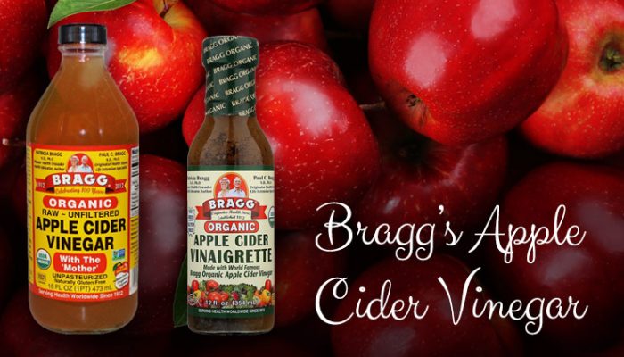 Braggs Apple Cider Vinegar And Salad Dressing Over Image Of Apples